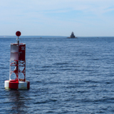 Silver Eel Cove buoy with Race Rock Light in the background